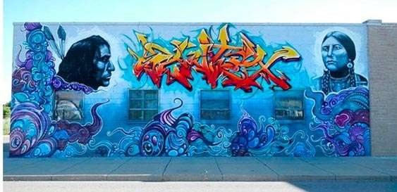 After: A plain brick exterior turned into a bold street-art mural.